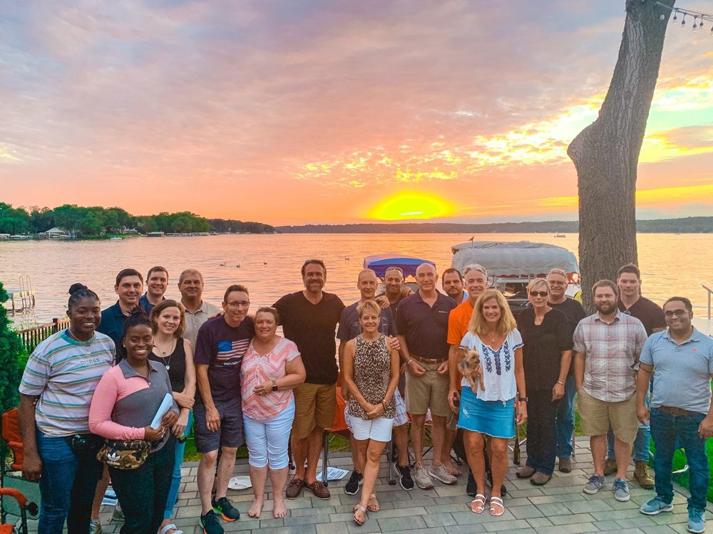Program community gathered beside a lake